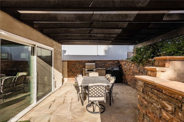 view of patio / terrace featuring a grill and outdoor dining area