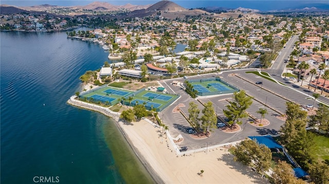 drone / aerial view featuring a residential view and a water and mountain view