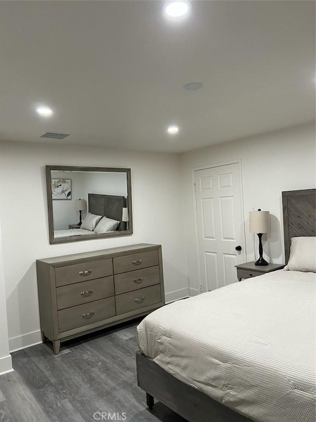 bedroom featuring dark hardwood / wood-style flooring