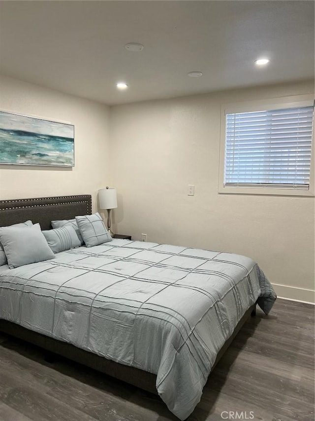 bedroom featuring dark hardwood / wood-style flooring