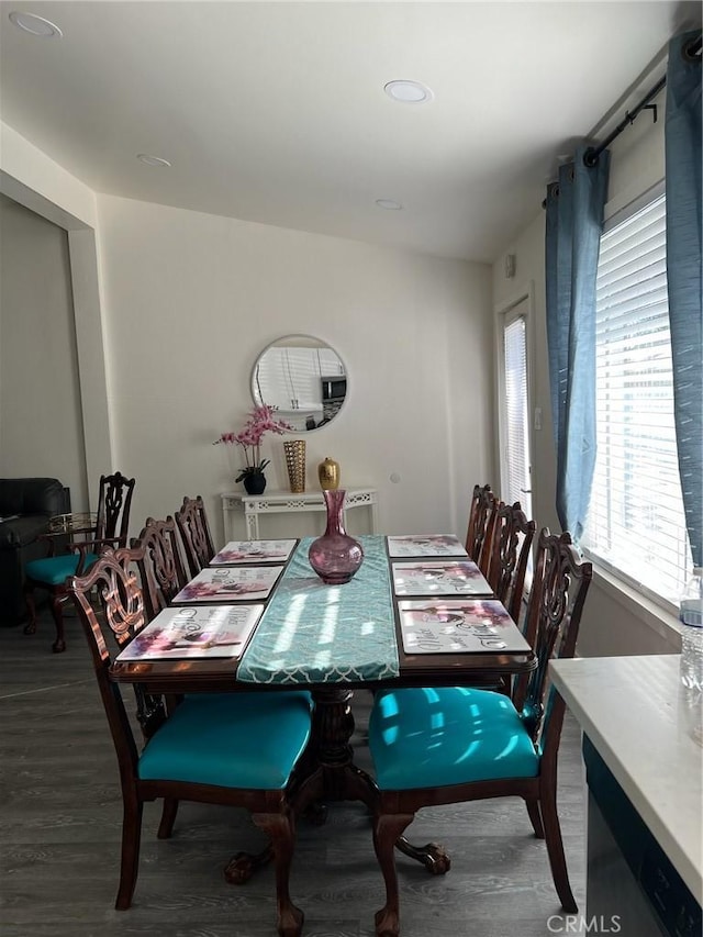 dining area with hardwood / wood-style floors