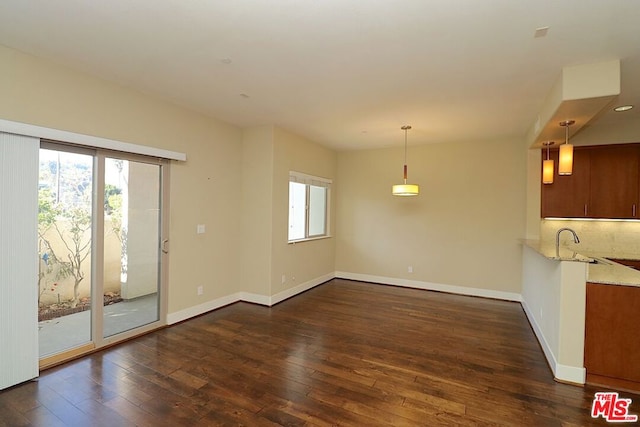 unfurnished dining area with dark hardwood / wood-style flooring