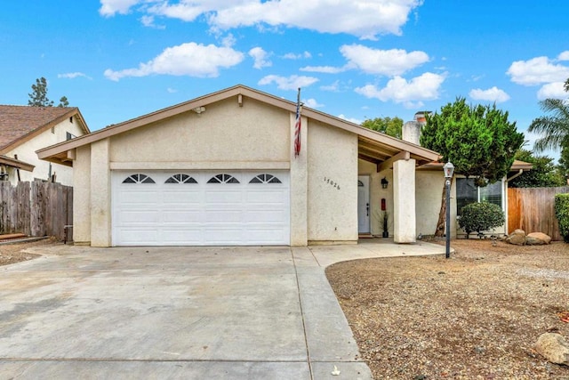 ranch-style house featuring a garage