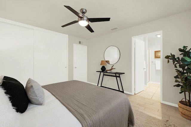 bedroom featuring connected bathroom and ceiling fan