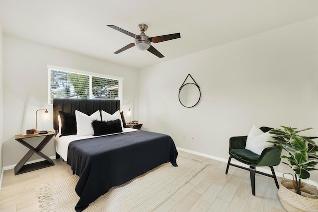 bedroom featuring ceiling fan and light hardwood / wood-style flooring