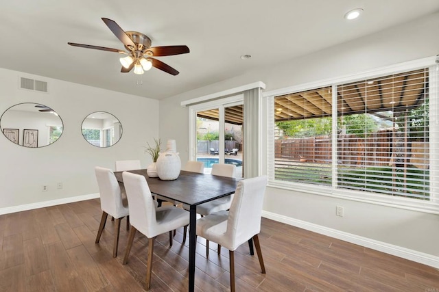 dining area with dark hardwood / wood-style flooring, a wealth of natural light, and ceiling fan