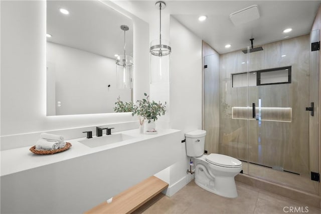 bathroom with vanity, a shower with shower door, and toilet