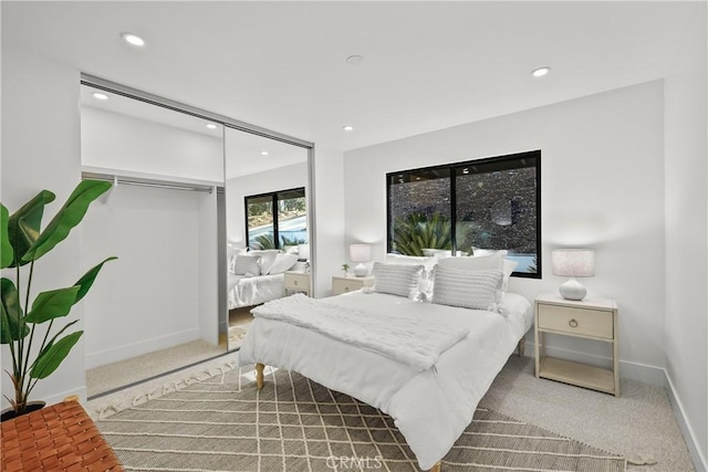 carpeted bedroom featuring a closet