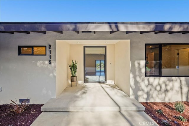 entrance to property with a patio area