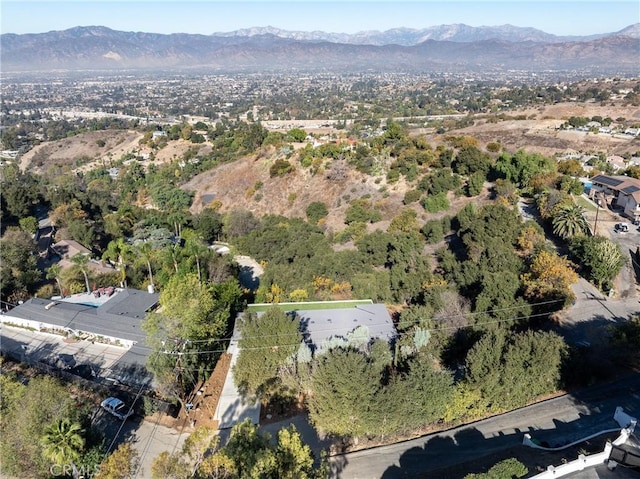 birds eye view of property featuring a mountain view