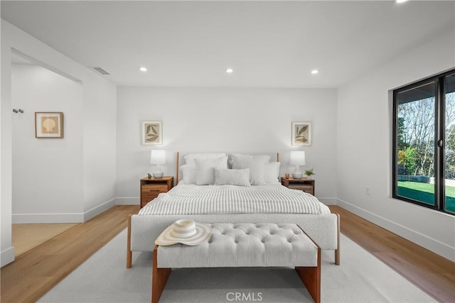 bedroom featuring light hardwood / wood-style floors