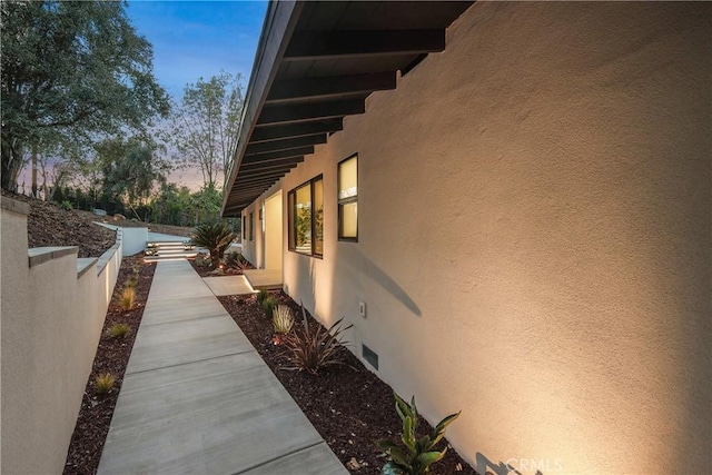 view of property exterior at dusk