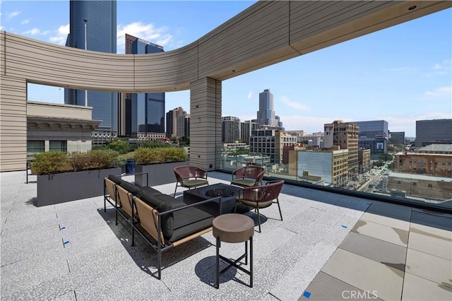 view of patio / terrace with a fire pit