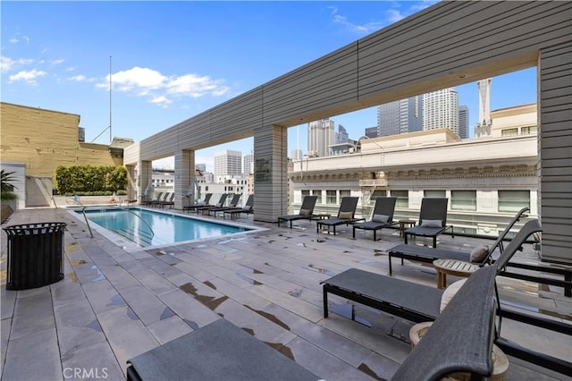 view of swimming pool with a patio area