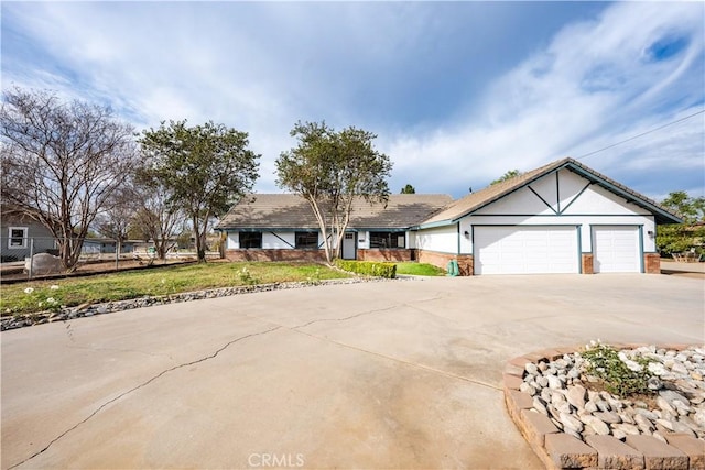 view of front of house with a garage and a front lawn