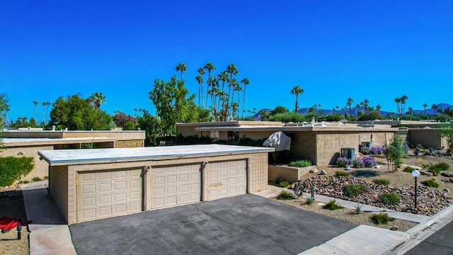 ranch-style house featuring a garage