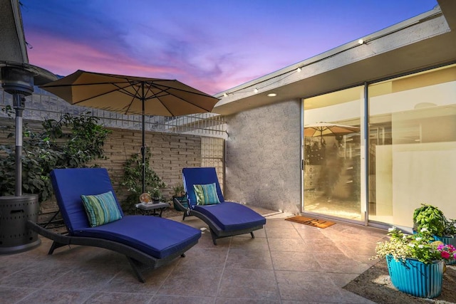 view of patio terrace at dusk