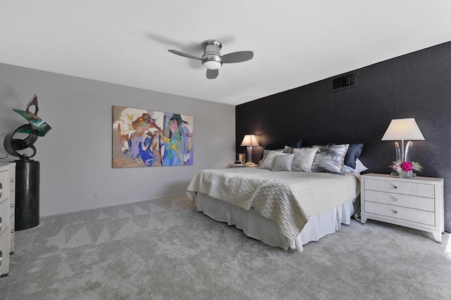 bedroom with ceiling fan and light carpet