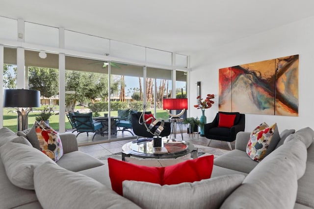 tiled living room featuring ceiling fan, a wealth of natural light, and expansive windows