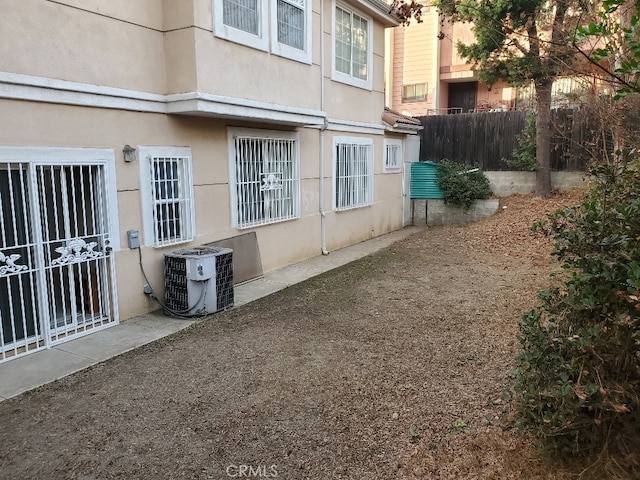 view of side of property featuring cooling unit