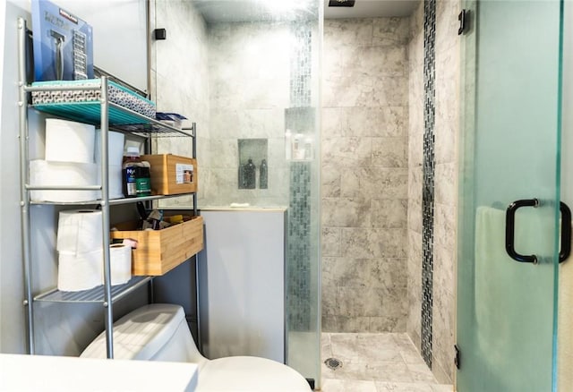 bathroom with toilet and walk in shower