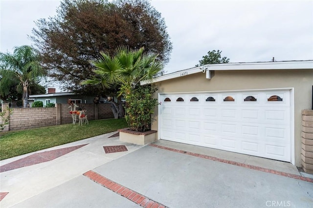 garage featuring a yard