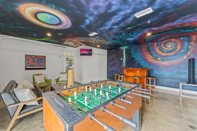 recreation room featuring bar area