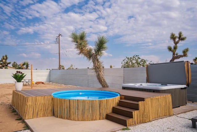 view of pool featuring a hot tub