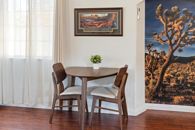 dining space featuring dark hardwood / wood-style flooring