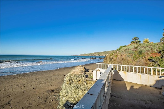 view of water feature with a beach view