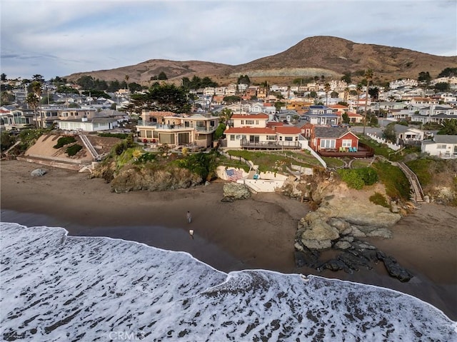 snowy aerial view featuring a mountain view