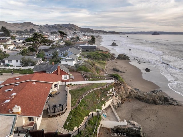 birds eye view of property with a water and mountain view