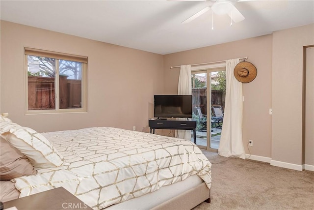 bedroom with ceiling fan, light colored carpet, and access to outside