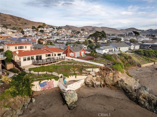 birds eye view of property with a mountain view