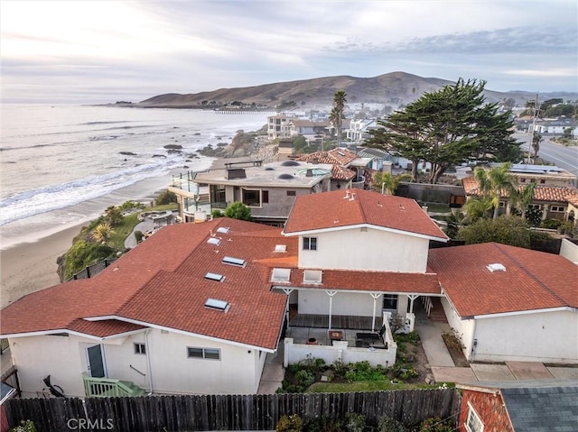 birds eye view of property featuring a water and mountain view