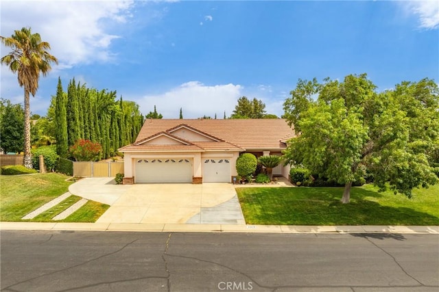 view of front of property with a garage and a front lawn