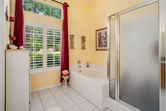 bathroom featuring tile patterned floors and plus walk in shower