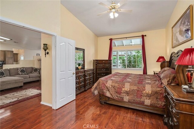 bedroom featuring ceiling fan, vaulted ceiling, and dark wood-type flooring