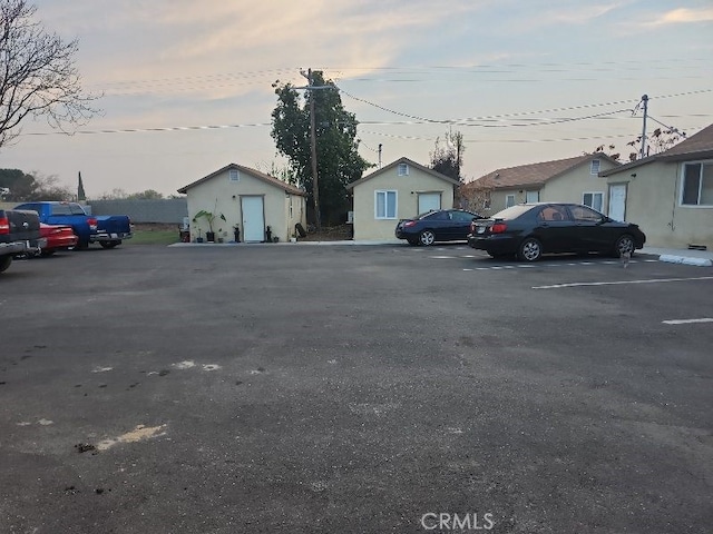 view of parking at dusk