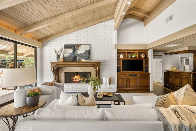 living room with beamed ceiling, high vaulted ceiling, and wood ceiling