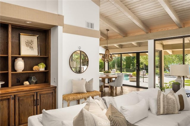 sunroom with an inviting chandelier, wooden ceiling, and beamed ceiling