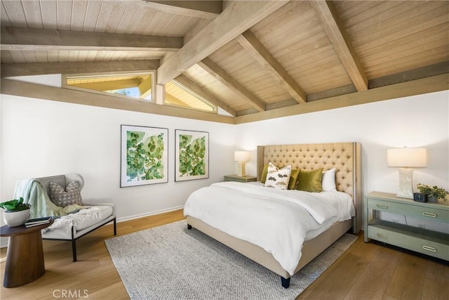 bedroom featuring vaulted ceiling with beams, hardwood / wood-style floors, and wooden ceiling