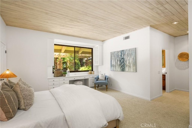 carpeted bedroom with wooden ceiling