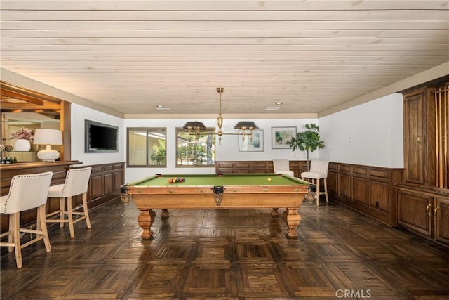 game room featuring wood walls, wood ceiling, dark parquet floors, and billiards