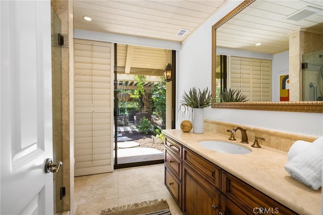 bathroom with tile patterned flooring, vanity, wooden ceiling, and a shower with shower door