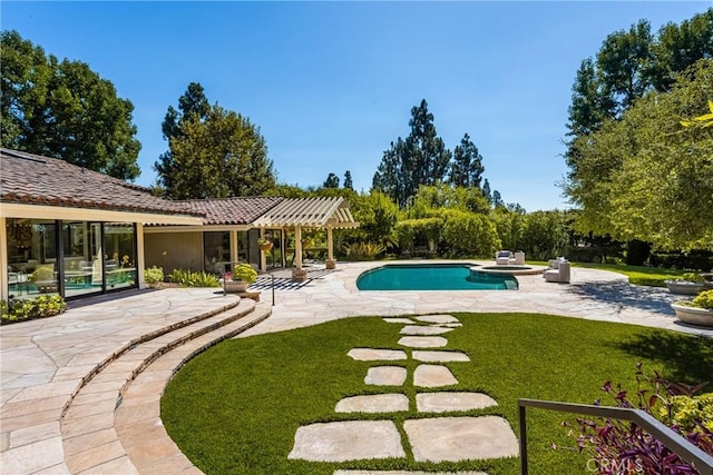 view of pool with a pergola, a patio area, and a lawn