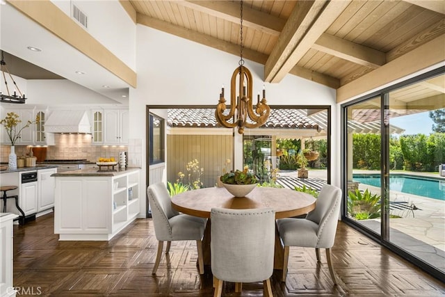 dining space featuring vaulted ceiling with beams, an inviting chandelier, wooden ceiling, and dark parquet floors