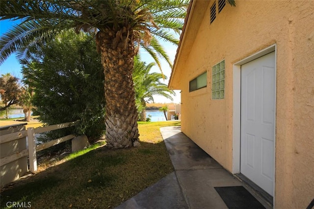 view of home's exterior with a water view