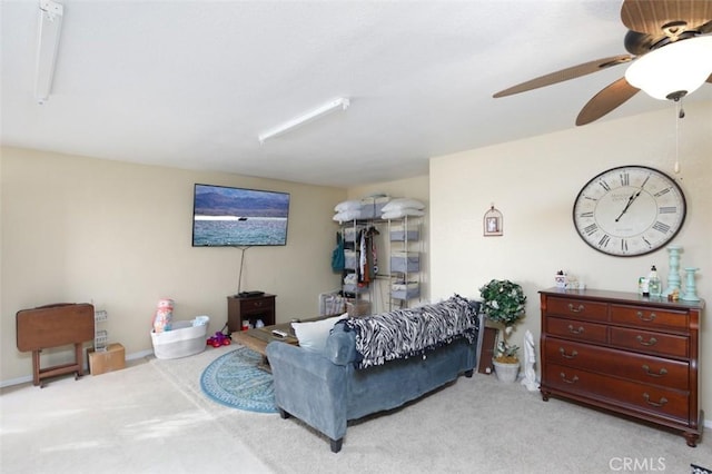 carpeted living room featuring ceiling fan