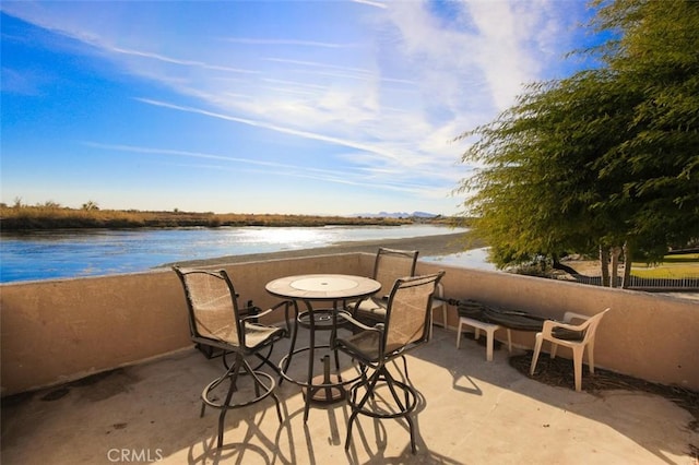 view of patio / terrace featuring a water view